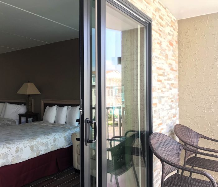 Ala Moana Motel suite A, view of the two queen beds, private balcony and chairs